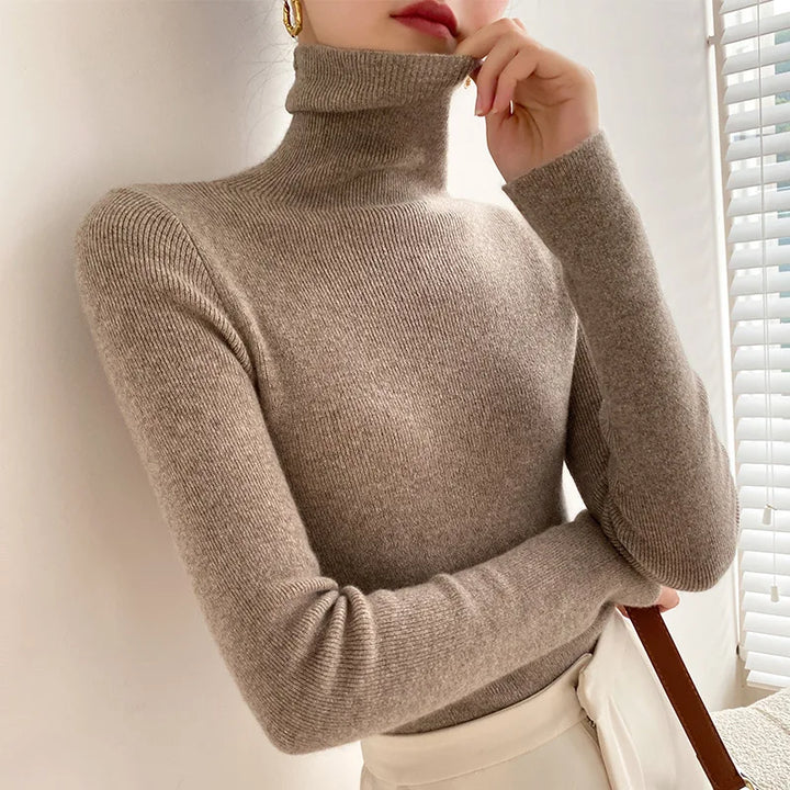 Form-fitting women's slim fit turtleneck sweater in soft knitwear, great long sleeve top for fall layering.