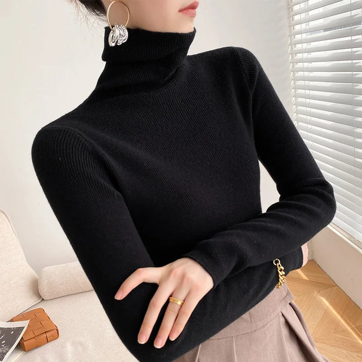 Women's slim fit knit turtleneck sweater with long sleeves, a comfy fall essential for casual everyday style.