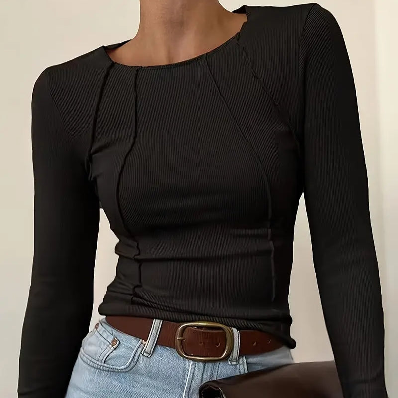 Modern women's slim fit top featuring a unique panel design. Great for comfortable everyday casual chic style.