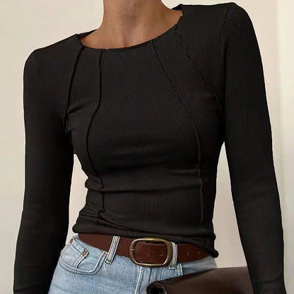 Modern women's slim fit top featuring a unique panel design. Great for comfortable everyday casual chic style.