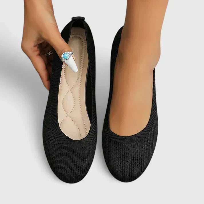 Front view of women's slip-on walking shoes, showcasing orthopedic design & crucial arch support for daily activity.