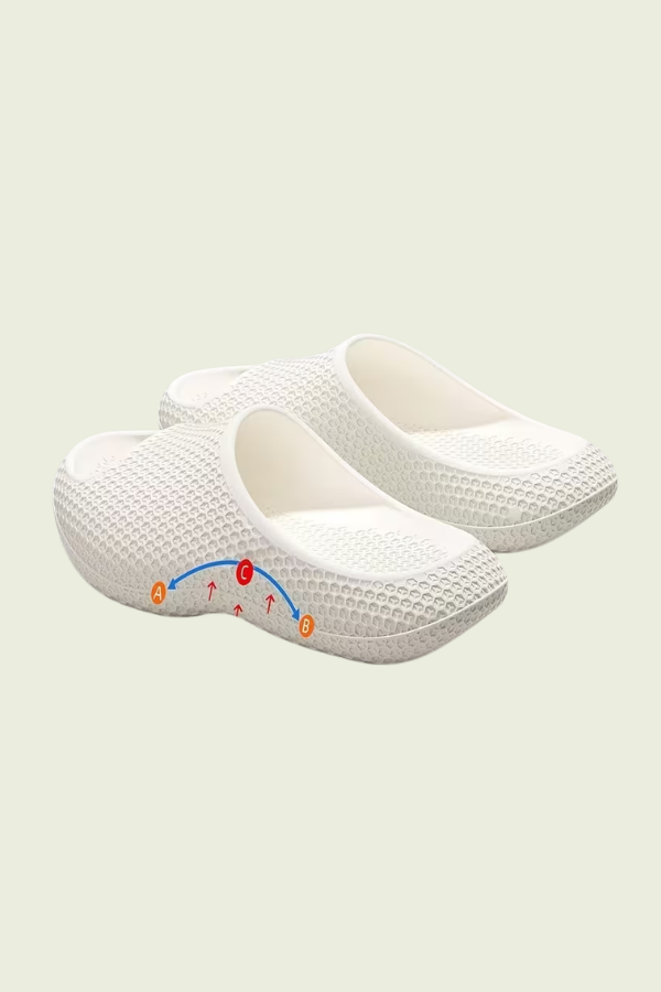 Cozy women's cushioned slip-on slippers with arch support, perfect comfort footwear for home.
