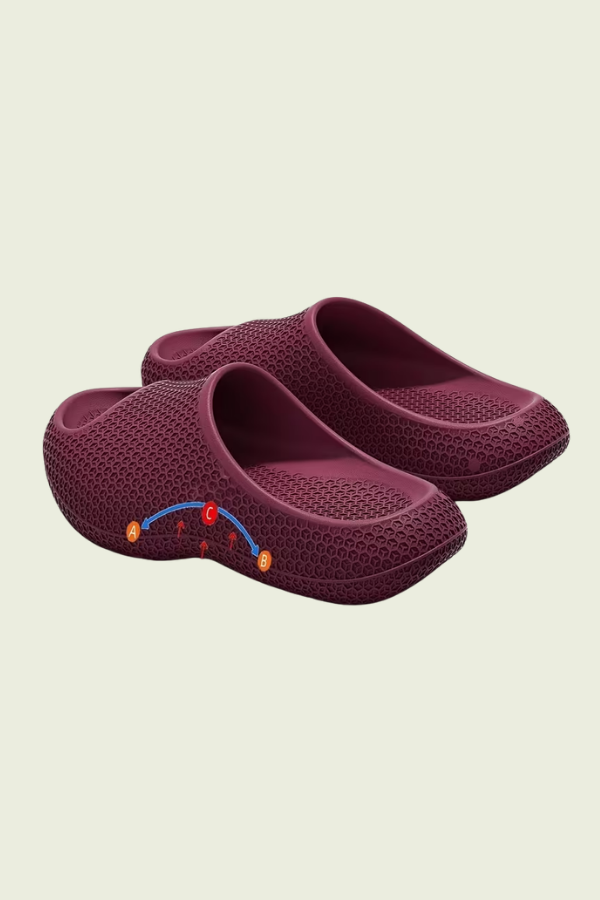 Stylish women's indoor slip-on slippers, offering foot support and comfort with arch design.