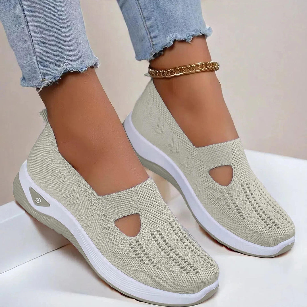 Comfortable women's spring sneakers with arch support. Easy slip-on design for active days.