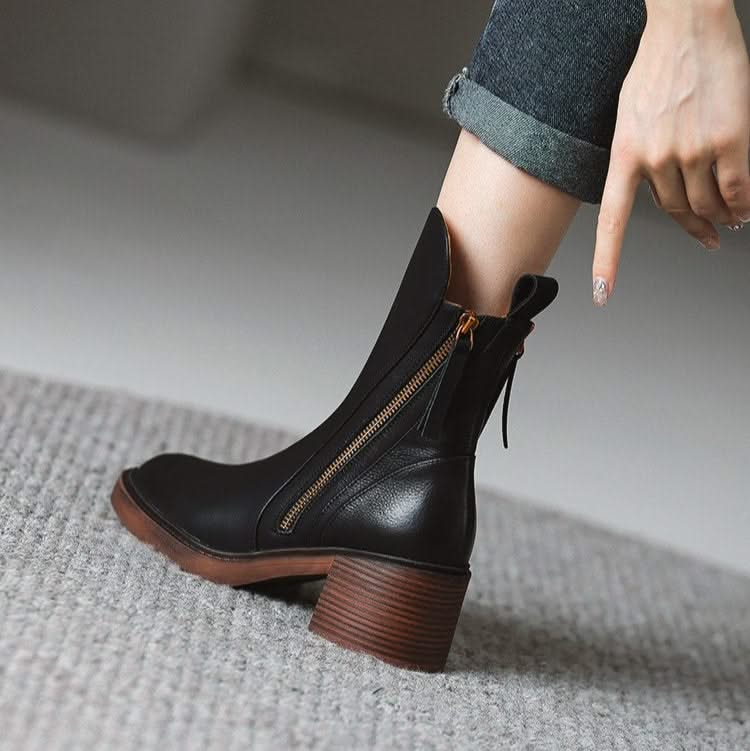 Women's Sloane black high-heel ankle boots, offering effortless style for any winter ensemble.