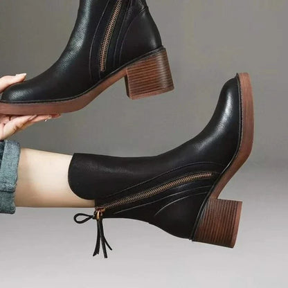 Detailed view of Sloane high-heel ankle boots, highlighting the elegant heel and craftsmanship.