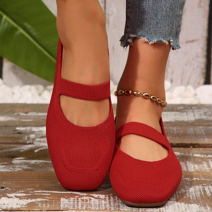 Playful smiling face women's Mary Jane ballet flats. Cute, comfortable, and casual slip-on shoes for everyday style.
