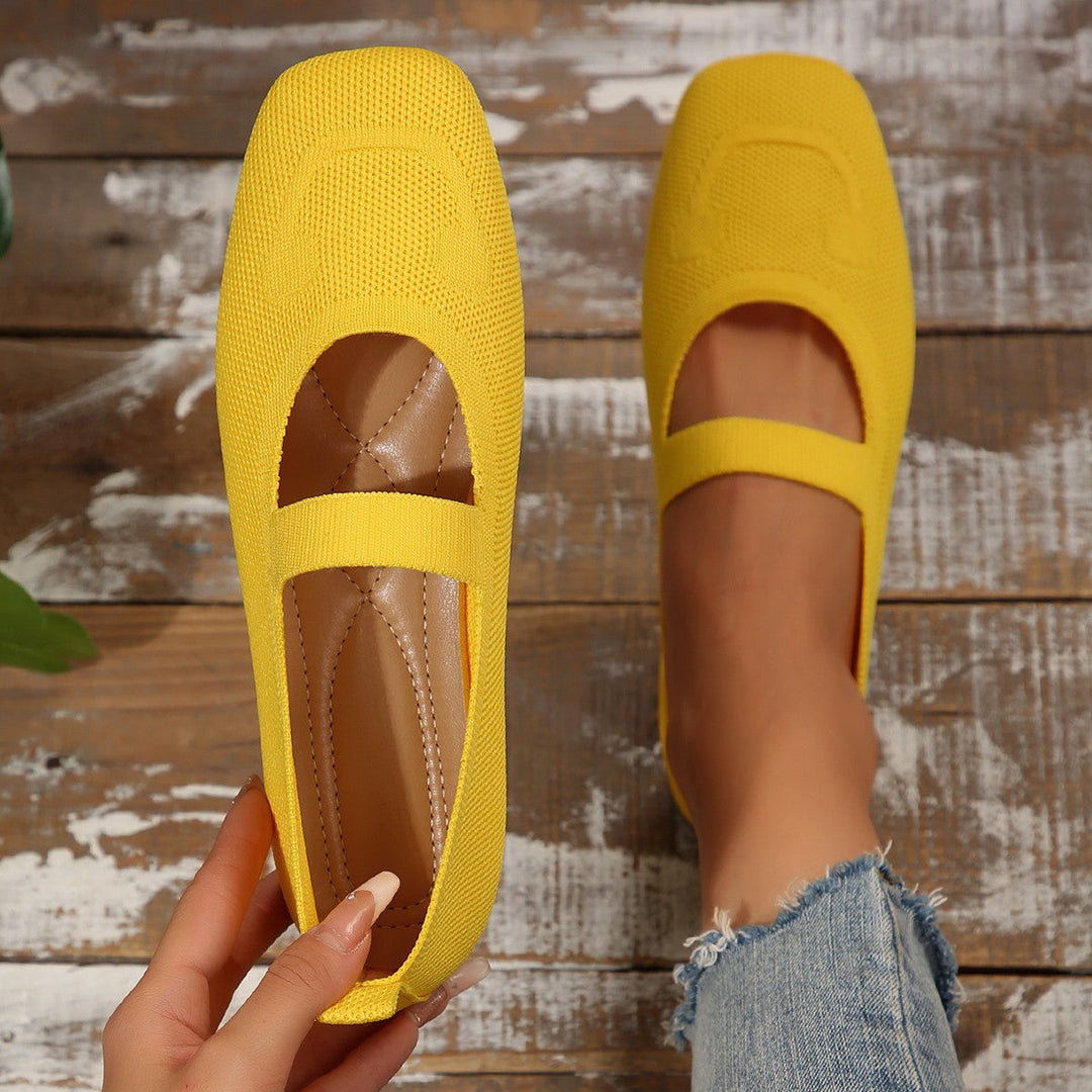 Fun women's smiling face ballet flats. Comfortable Mary Jane style slip-on shoes, ideal for stylish and playful everyday wear.