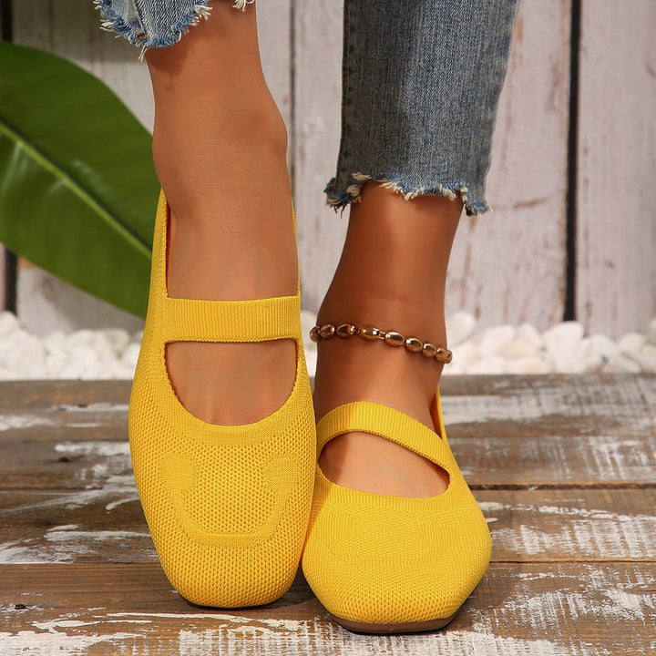 Playful women's slip-on ballet flats with smiling face design. Comfortable Mary Jane style for cute, casual everyday shoes.