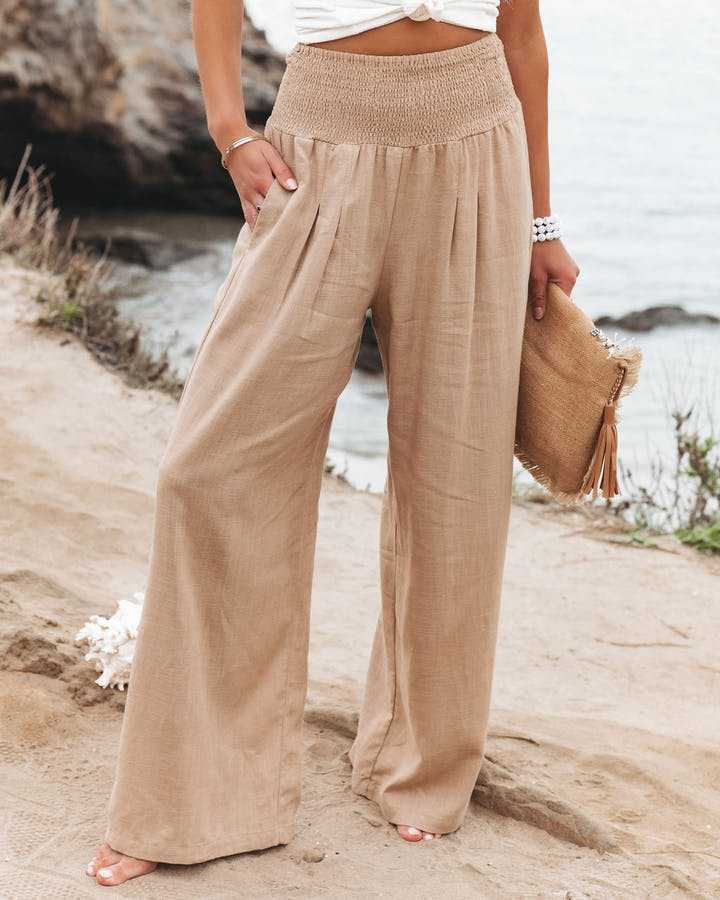 Women's smocked high waist wide leg pants, perfect for casual comfort & summer fashion.