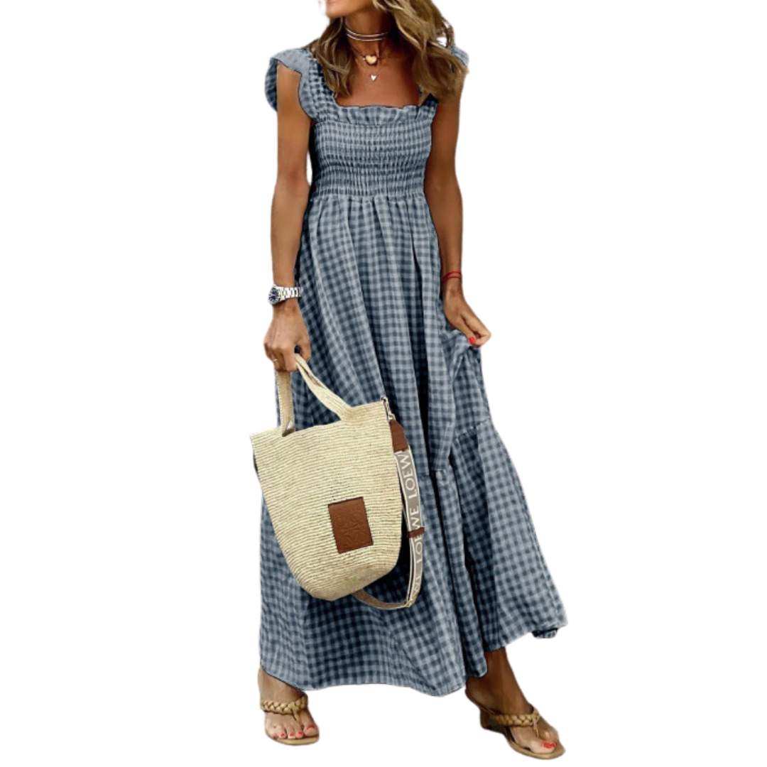 Casual women's smocked tiered maxi dress with pockets. Effortless style for spring and summer, a comfortable vacation dress.