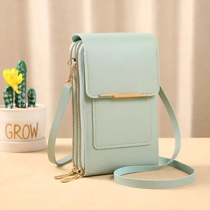 Close-up of anti-theft zippers on a women's soft leather shoulder bag, secure for travel essentials.