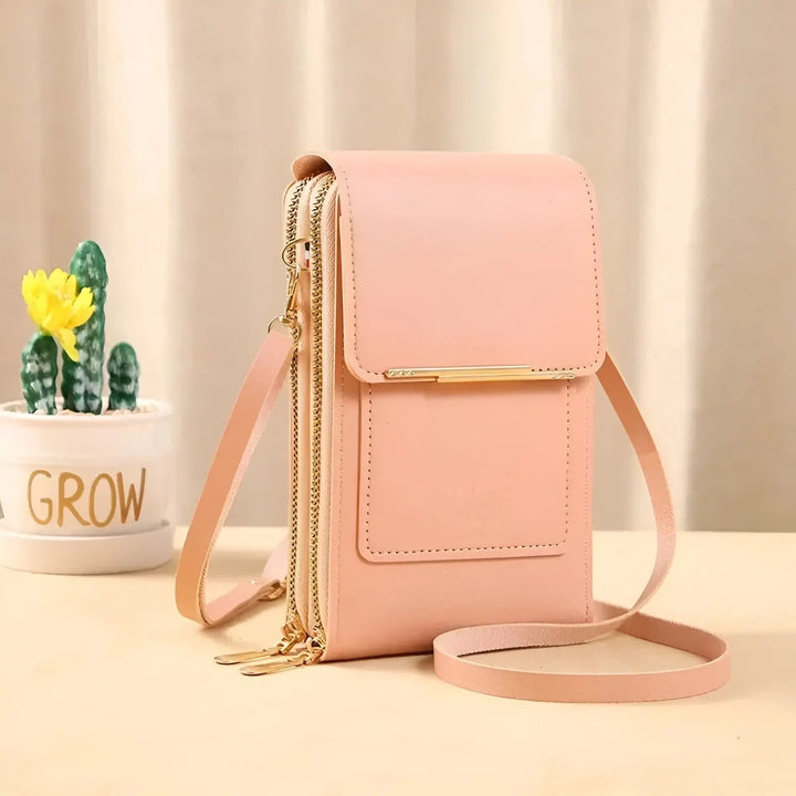 Back view of a women's soft leather anti-theft shoulder bag with secure zipper pocket.