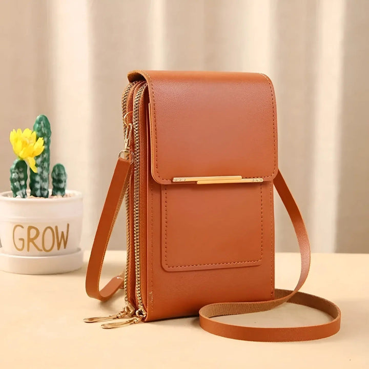 Textured close-up of soft genuine leather on a women's anti-theft shoulder bag, premium quality.
