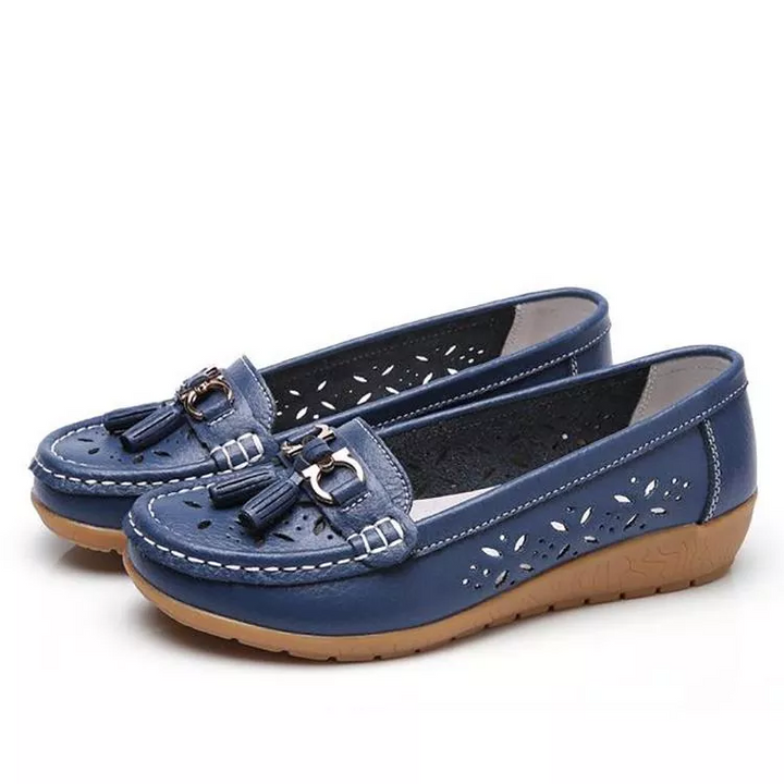 Close-up of women's breathable moccasin sandals, showcasing soft material and detailed stitching.
