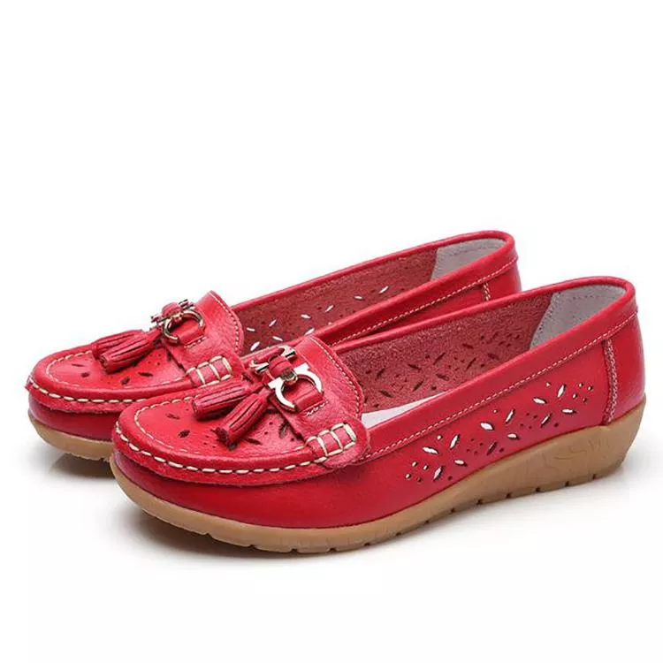 Pair of women's soft moccasin sandals, ready for comfortable summer adventures.