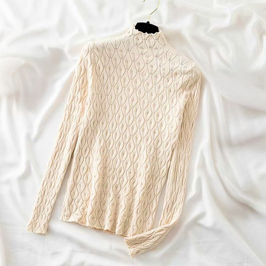 Women's soft cashmere blend turtleneck sweater in a classic knit design for winter fashion.