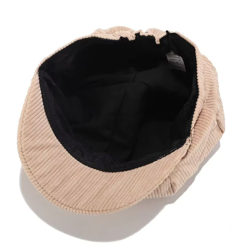 Vintage-inspired women's corduroy cap. Soft, comfortable accessory adding effortless style to any casual outfit.