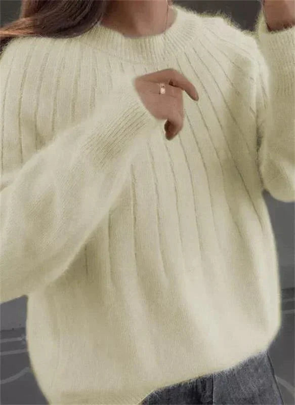 Warm women's cozy textured knit sweater. Stylish fall/winter long-sleeve pullover for comfort.