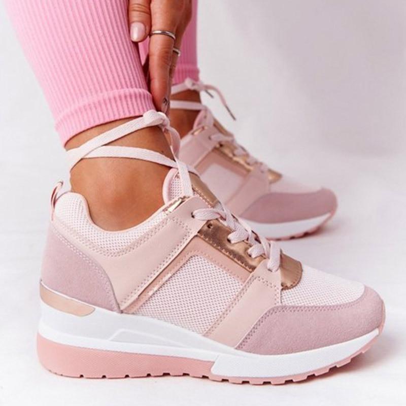 Supportive women's athletic shoes for everyday walking. Features soft cushioning & breathable material for comfort.
