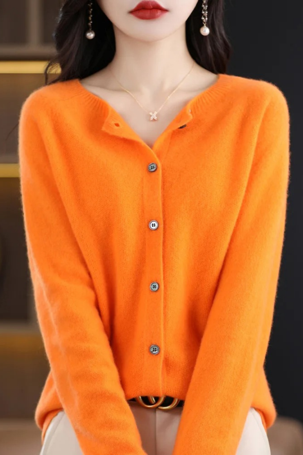 Soft knit women's long cardigan with button details, providing effortless style and cozy comfort.