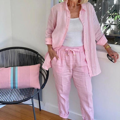 Plus size women's soft lounge set, two-piece comfort with button-up shirt & drawstring pants.