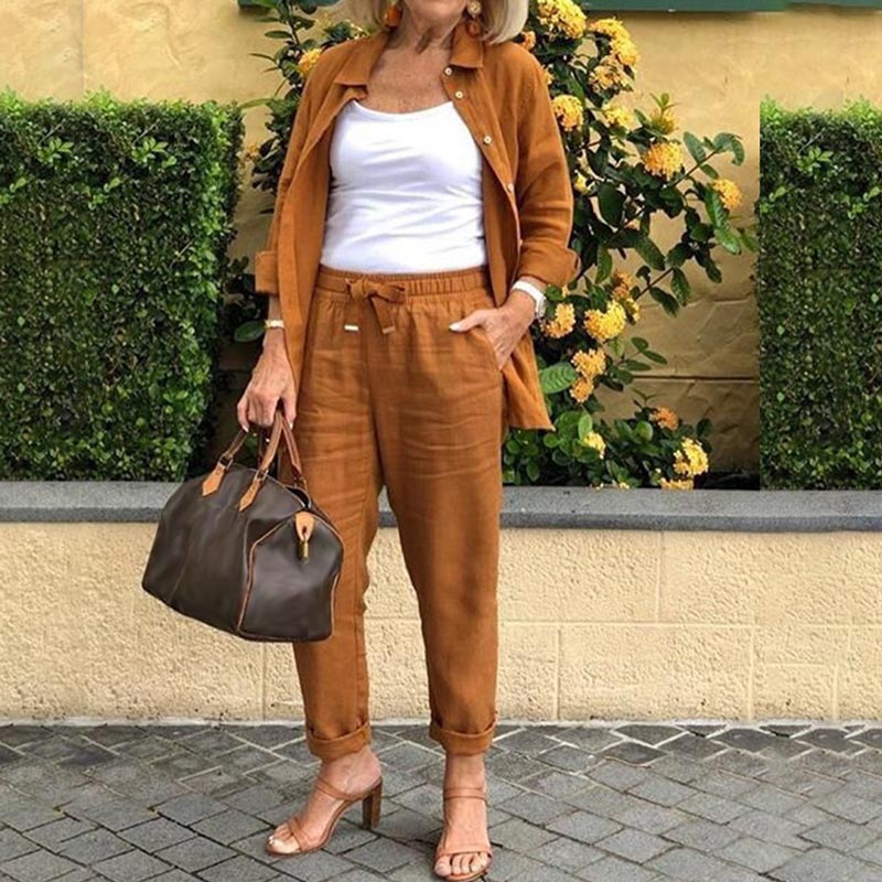 Soft women's two-piece pajamas, button-up shirt & drawstring pants, cotton-linen blend for relaxed sleep.