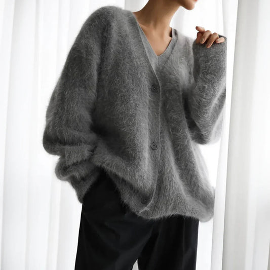 Women's soft open front cardigan in a relaxed fit, perfect for cozy layering during fall and winter. Elegant long sleeve.