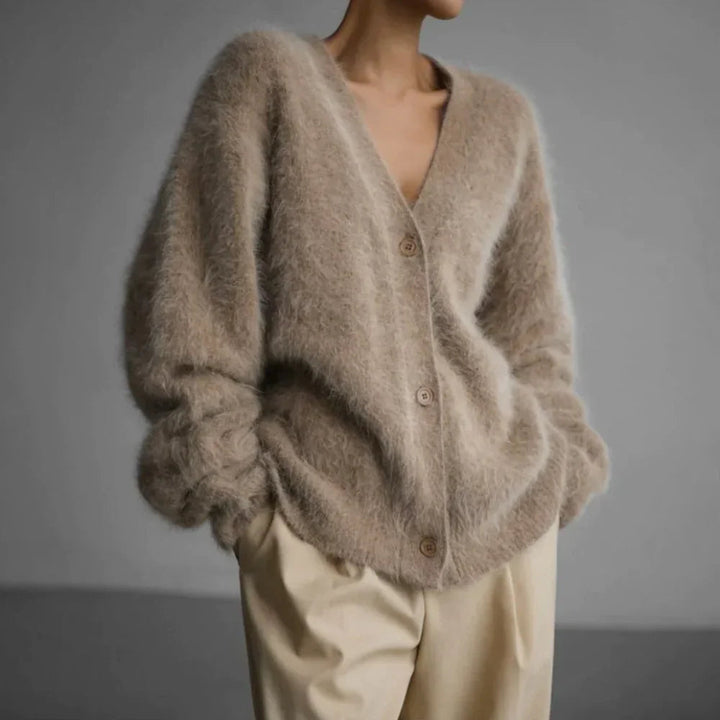 Cozy women's open front cardigan, ideal for casual layering in fall and winter. Features a soft fabric and relaxed fit.