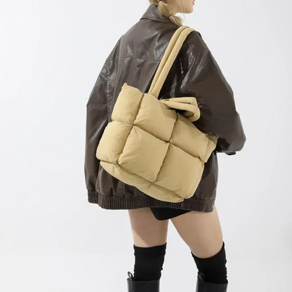 Comfortable women's padded tote bag, soft puffer texture. Spacious shoulder carry handbag for daily fashion.