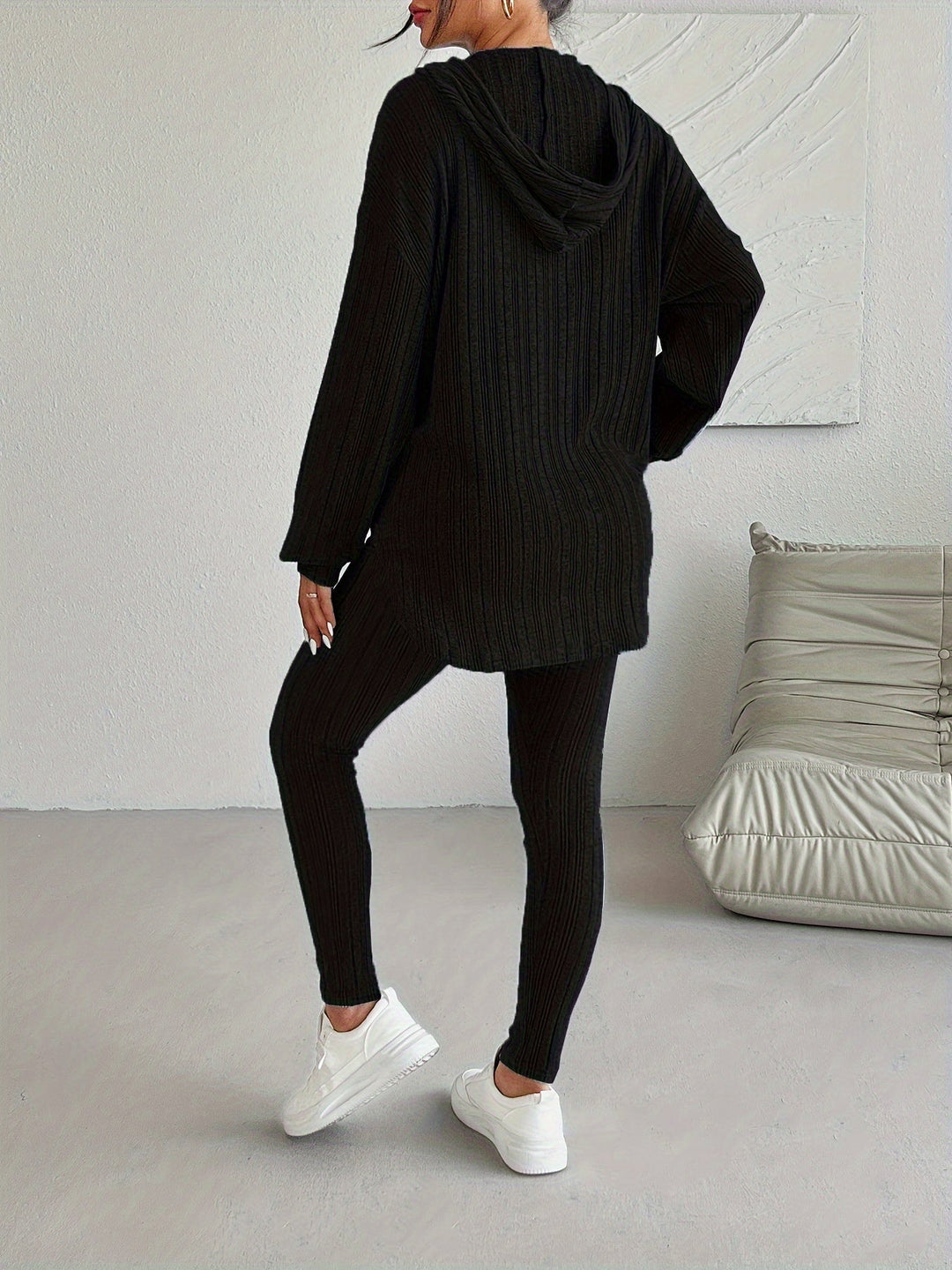 Cozy women's ribbed knit hoodie, a key piece of a comfortable lounge set, great for casual athleisure.