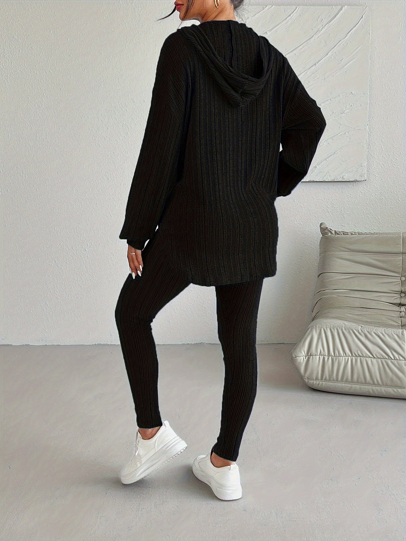 Cozy women's ribbed knit hoodie, a key piece of a comfortable lounge set, great for casual athleisure.