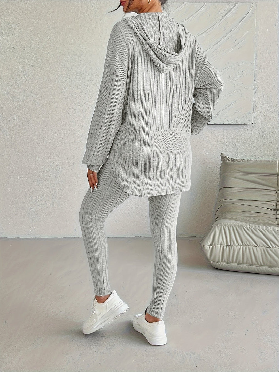 Detail shot of the drawstring on a women's ribbed knit hoodie, part of a comfortable lounge set.