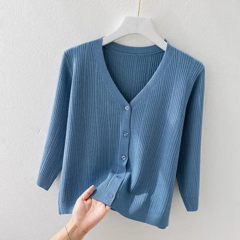 Front view of a women's stylish soft ribbed knit v-neck cardigan with functional button-front closure.