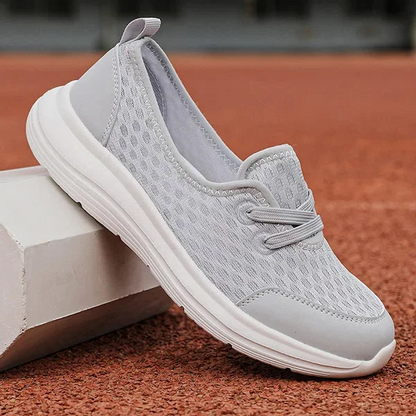 Woman walking in comfortable arch support shoes. Soft sole, great for pain relief & posture correction.