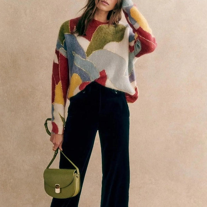 Stylish women's textured knit pullover sweater with crewneck. Soft, elegant long sleeve top for fashion-forward looks.