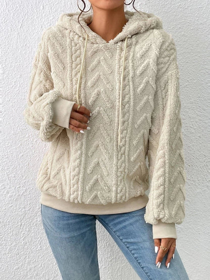 Relaxed fit women's cable-knit style pullover. Comfortable long sleeve sweater, perfect for casual wear.