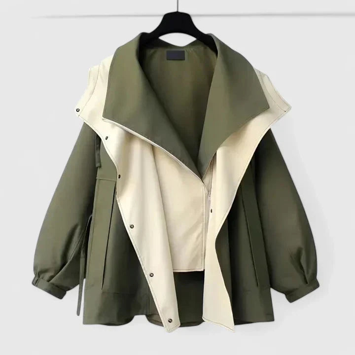 Women's sophisticated water-repellent jacket with adjustable waist, perfect for all-weather style.