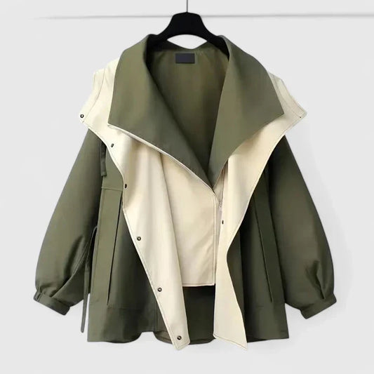 Women's sophisticated water-repellent jacket with adjustable waist, perfect for all-weather style.