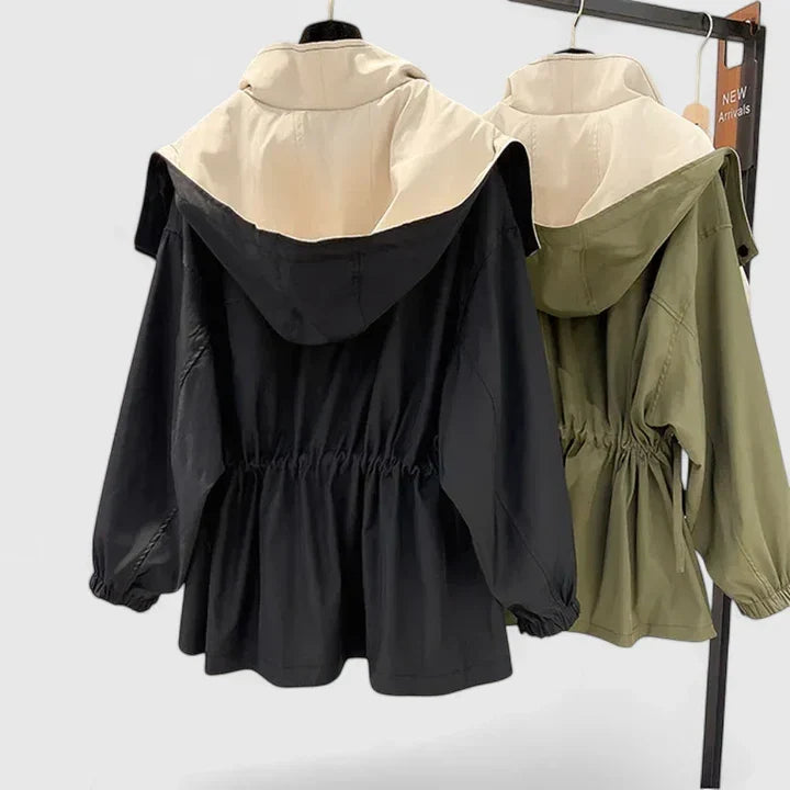 Women's elegant water-repellent jacket with adjustable waist, offering a flattering and lightweight fit.