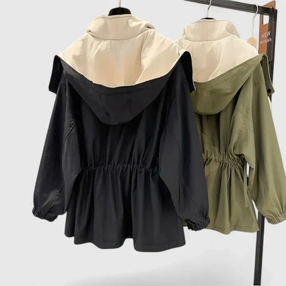 Women's elegant water-repellent jacket with adjustable waist, offering a flattering and lightweight fit.