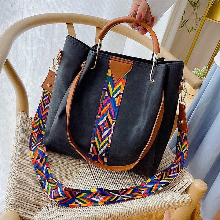 Women's spacious PU leather tote bag for everyday carry, work, and travel. Stylish shoulder bag accessory.
