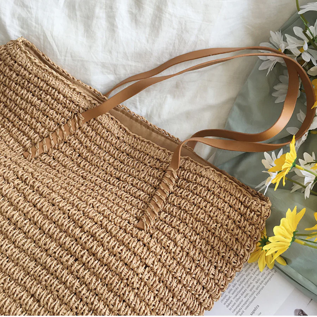 Stylish TerraWoven women's handbag. Features unique woven design, spacious interior, and durable shoulder strap.
