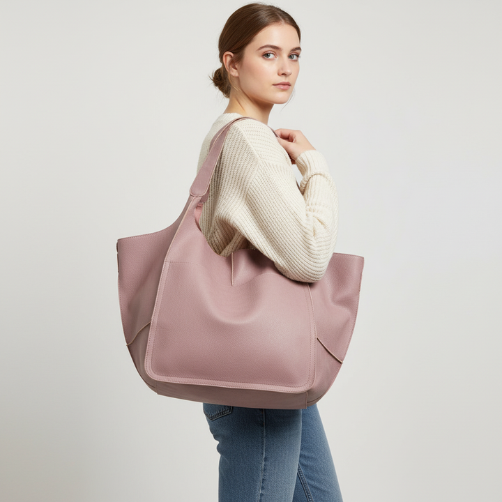 Chic black vegan leather tote bag for women. A large capacity shoulder bag perfect for a sophisticated look.