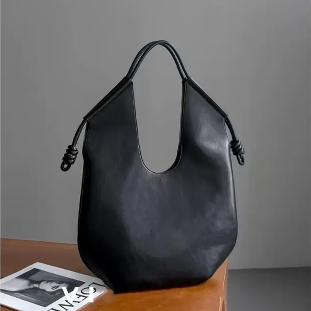 Women's spacious vegan leather tote bag, perfect carryall for everyday use.