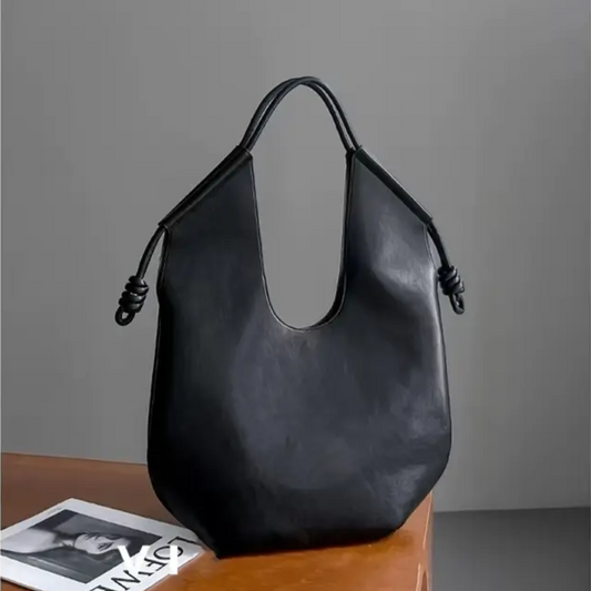 Women's spacious vegan leather tote bag, perfect carryall for everyday use.