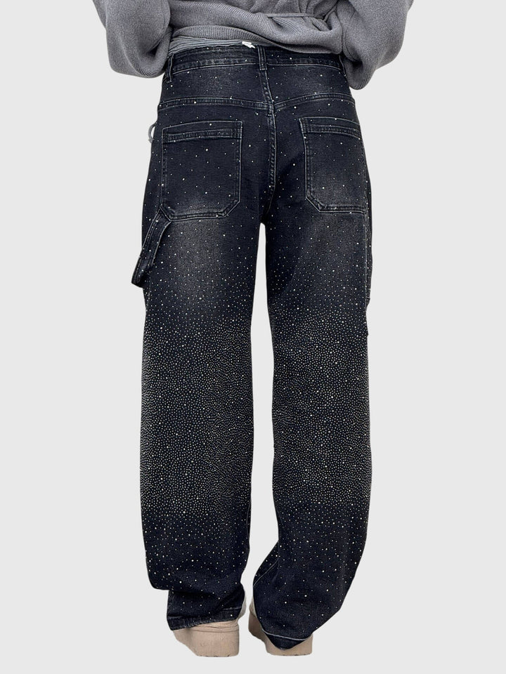 Side view of women's sparkling diamond loose fit pants, showcasing elegant drape.
