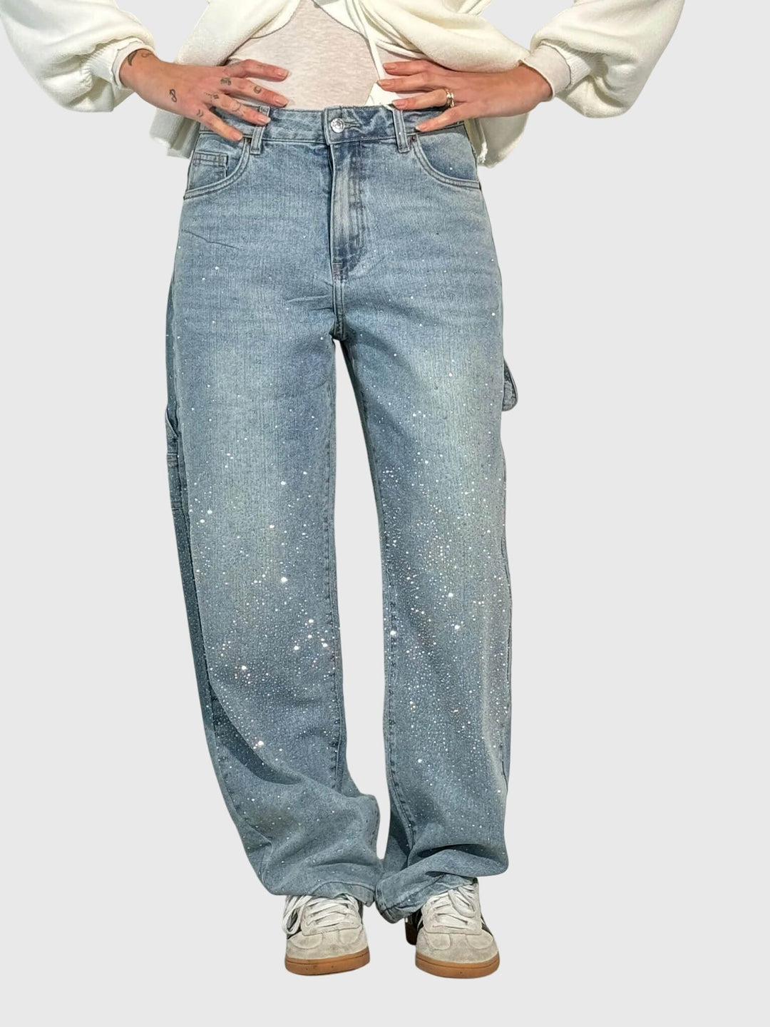 Elegant women's black pants with sparkling diamond accents, a luxurious loose fit design.