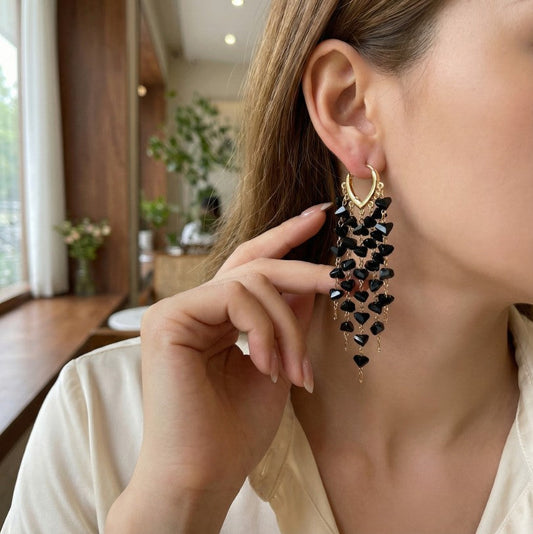 Women's sparkling irregular crystal tassel earrings, perfect for adding glamour to any outfit.