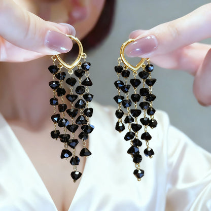 Women's sparkling crystal dangle earrings with irregular tassels, adding elegance & glamour.